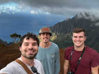 Kōkeʻe State Park vantage with Ryan and Isaiah overlooking the Nā Pali Coast.